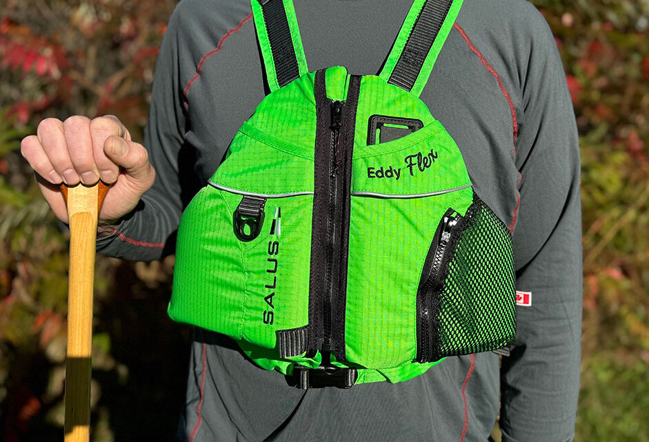 a man poses while wearing the Salus Eddy Flex life vest