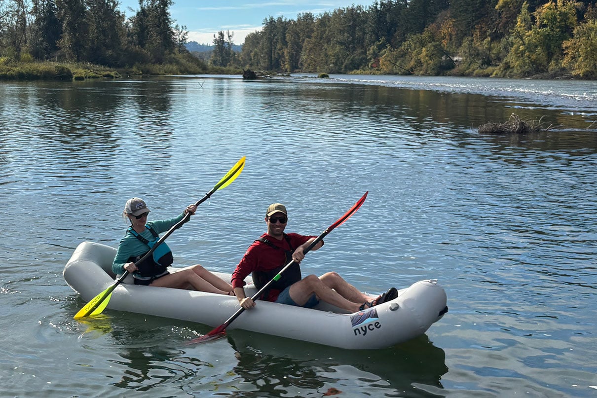 JAuthor oe Potoczak paddles the Nyce Haul tandem inflatable kayak with a partner on an Oregon river.