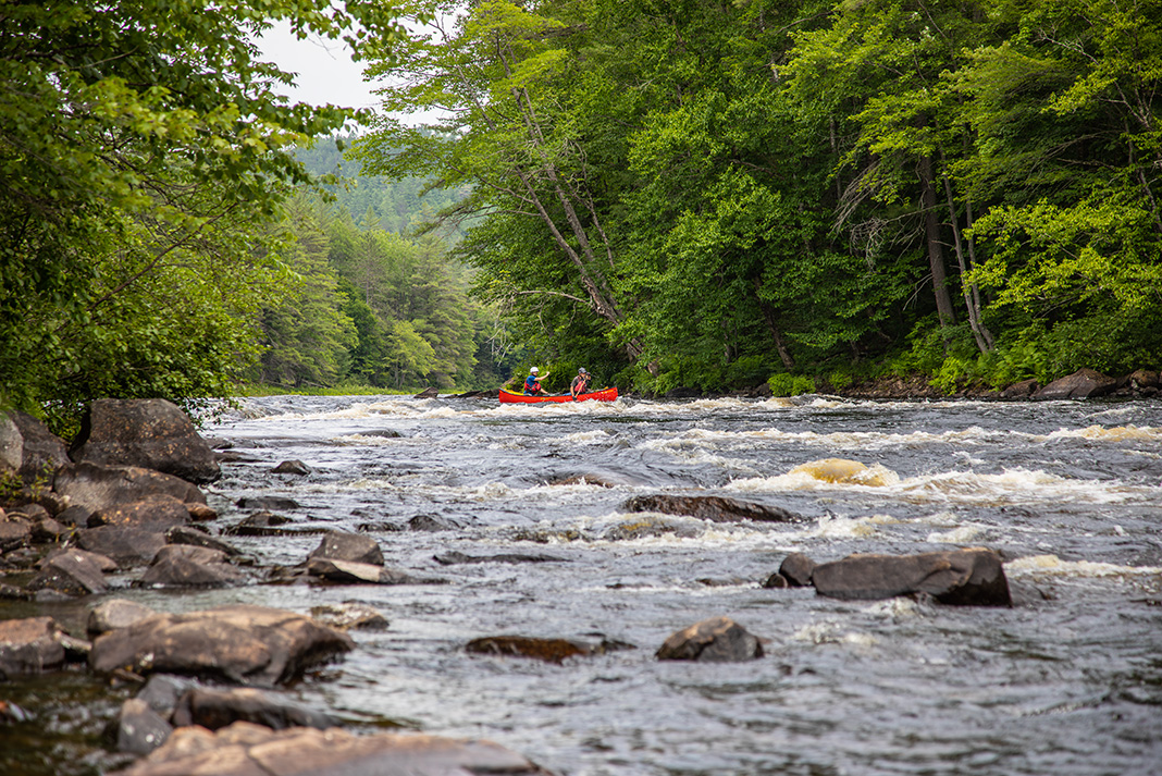 two people canoeing down the Dumoine River