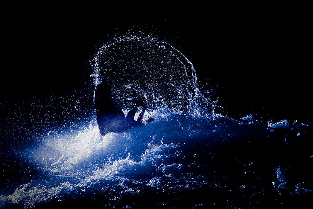 eric jackson performs a freestyle whitewater kayaking move