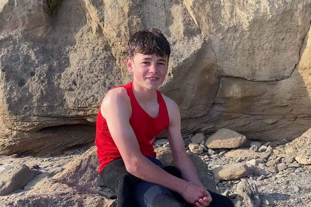 Oscar describing the rescue to Neil Phillips of Saunton Surf Life Saving Club. | Photo: Neil Phillips