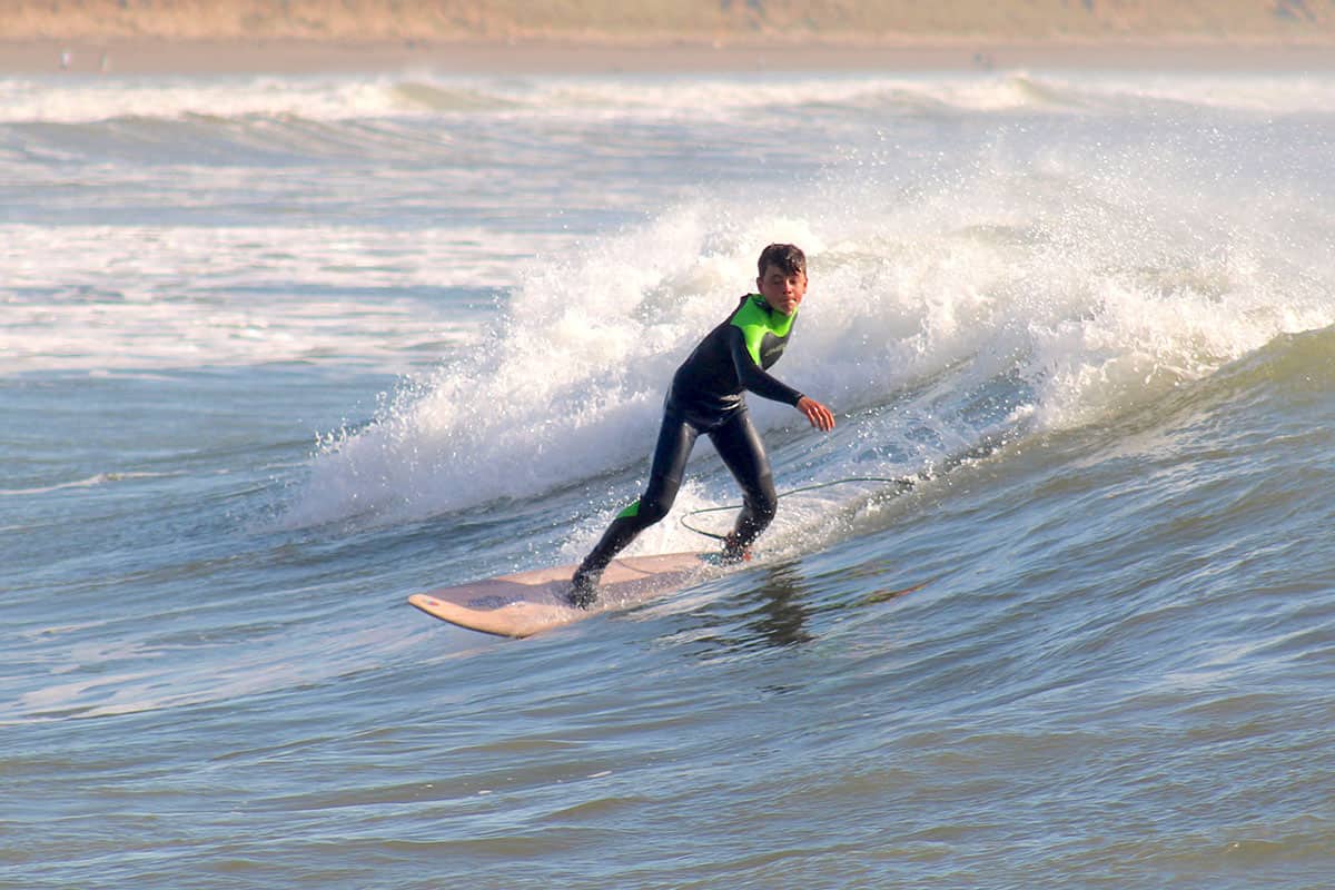 Young Oscar carving a turn at Saunton Sands the day of the rescue. | Photo: Neil Phillips